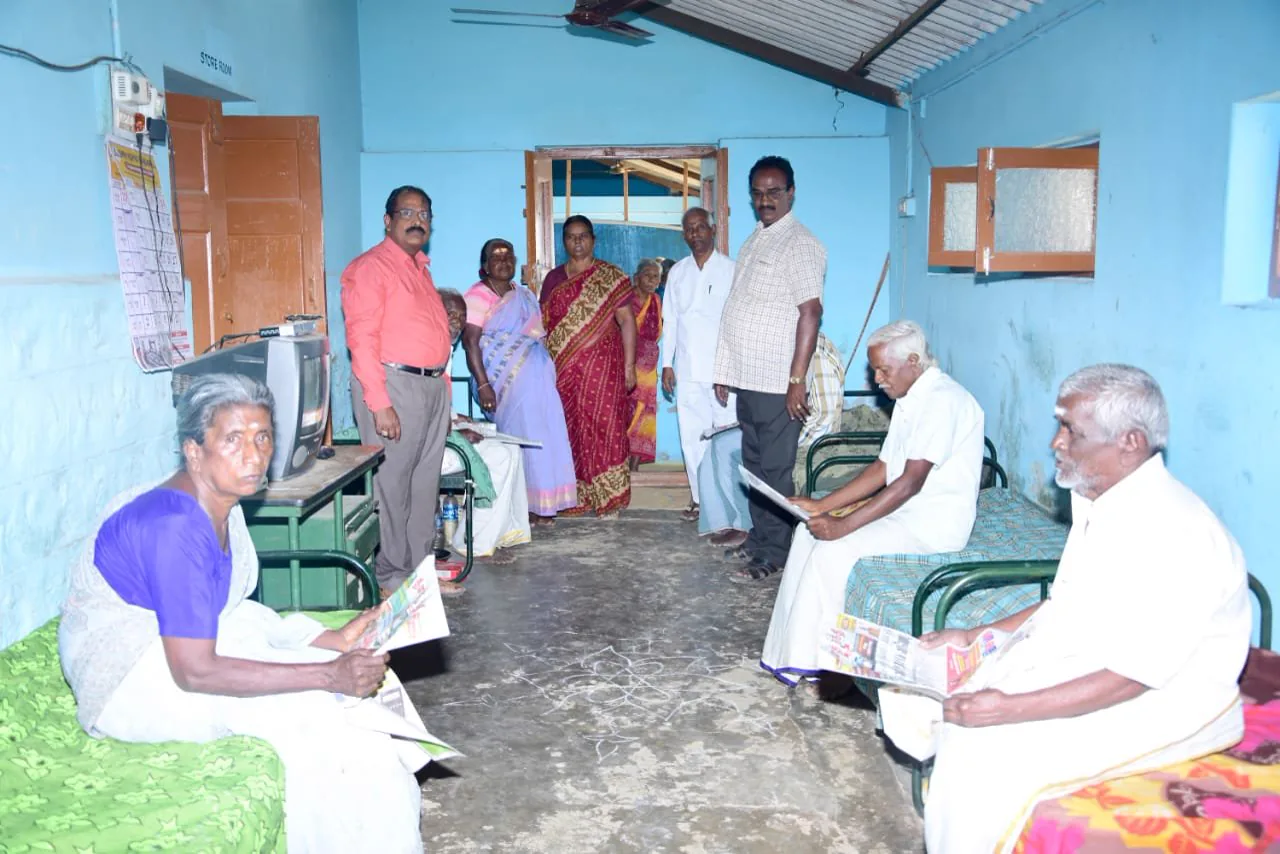Older people sitting together in a room at the home